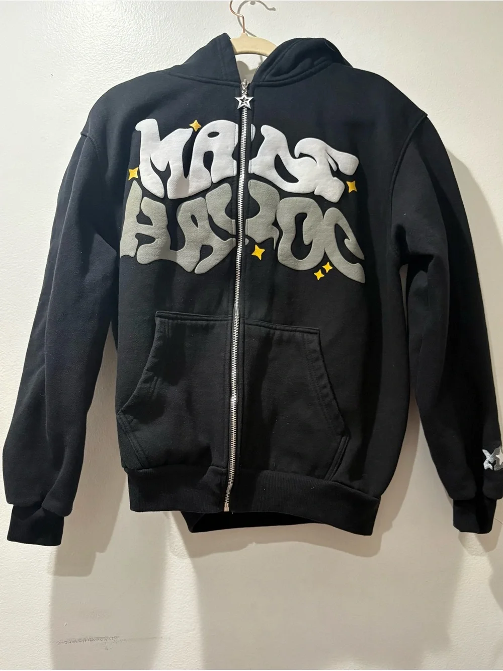 Black Zip-Up Hoodie with Silver Graphic and Yellow Star Accents